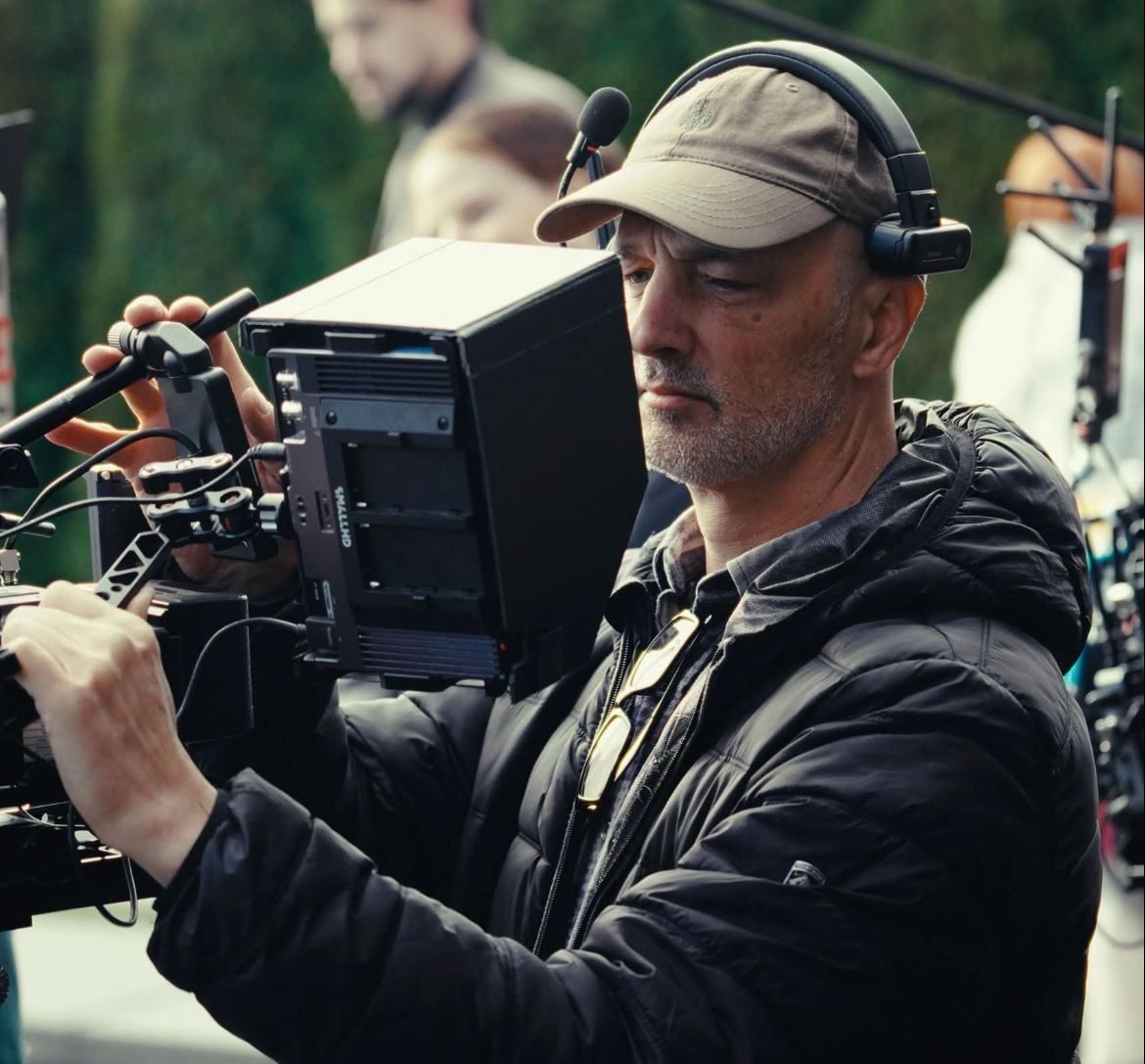 Camera operator lining up a shot with a matte box rig